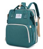 Diaper bag backpack — side view showing exterior pockets and grab handle
